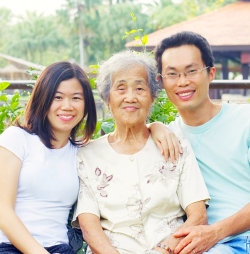 two caregivers with an elder