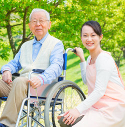 caregiver and elder smiling